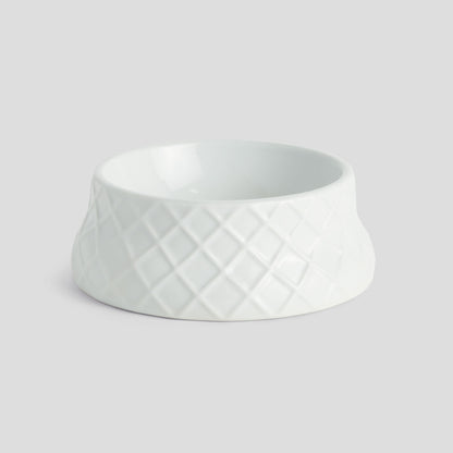 Small white handcrafted porcelain trellis pet bowl - stylish home accent (Image1).