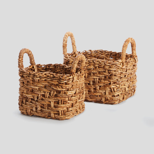 Small woven banana leaf baskets with handles (set of 2) - stylish home accent (Image1).