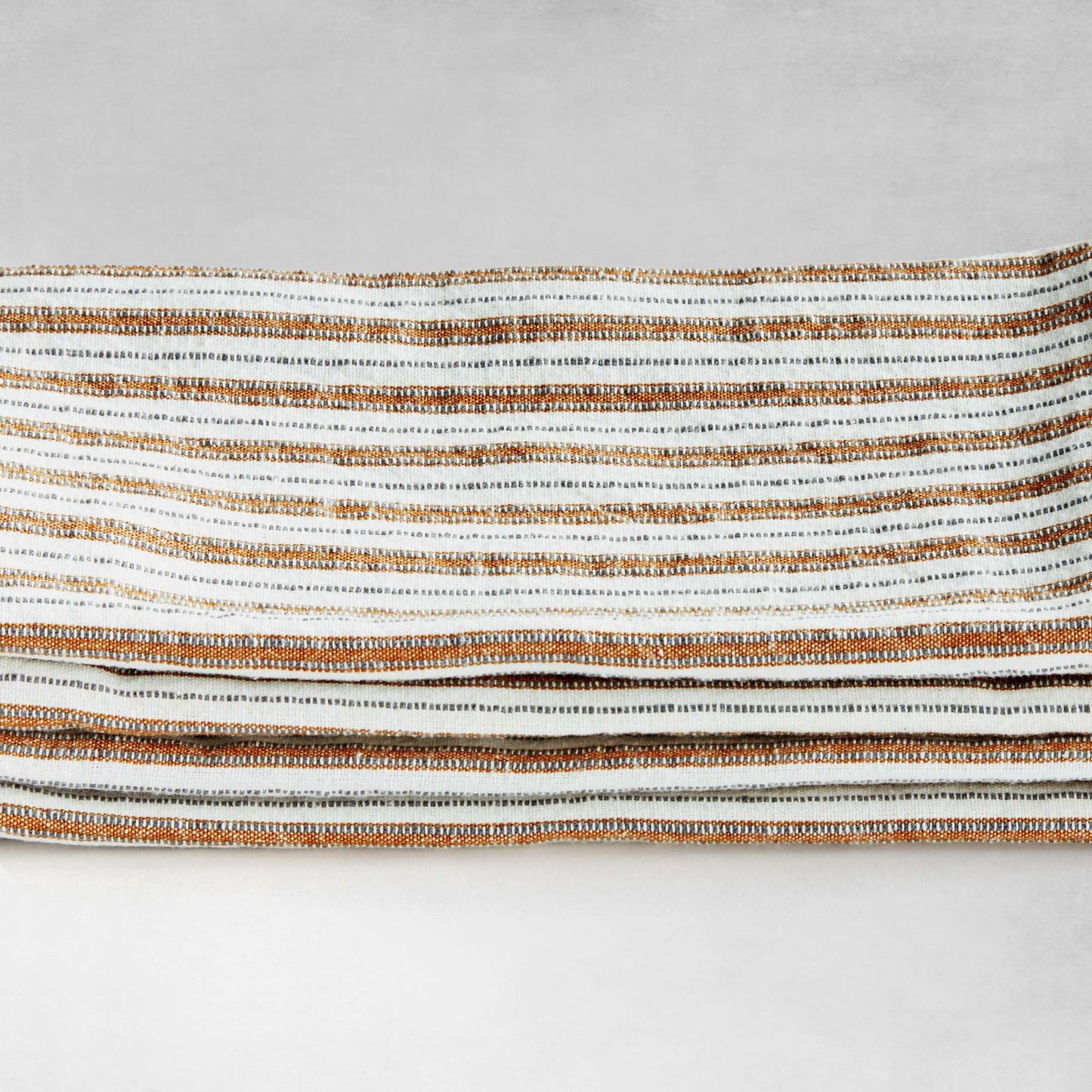 Striped square cotton dinner napkins set of 4, stacked, closeup view of side.