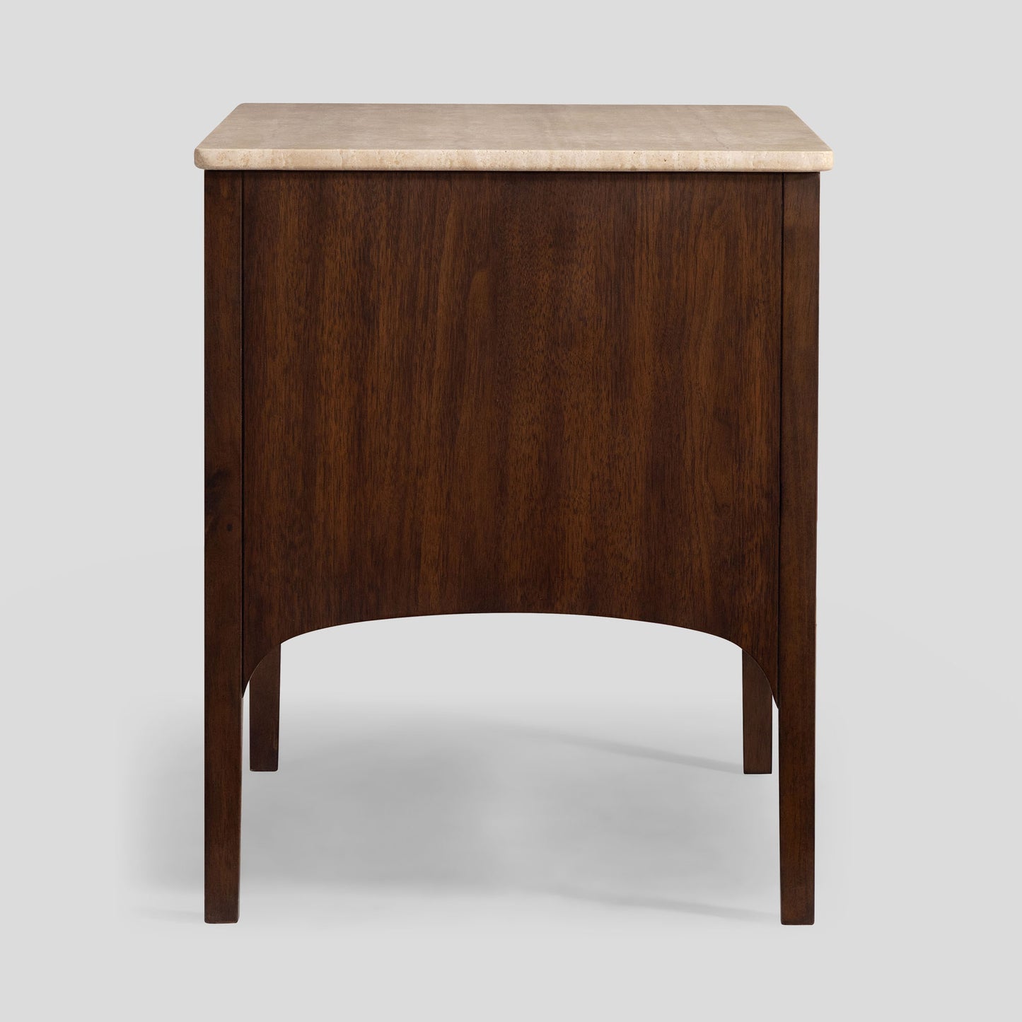 Wooden nightstand with travertine top on a light gray background