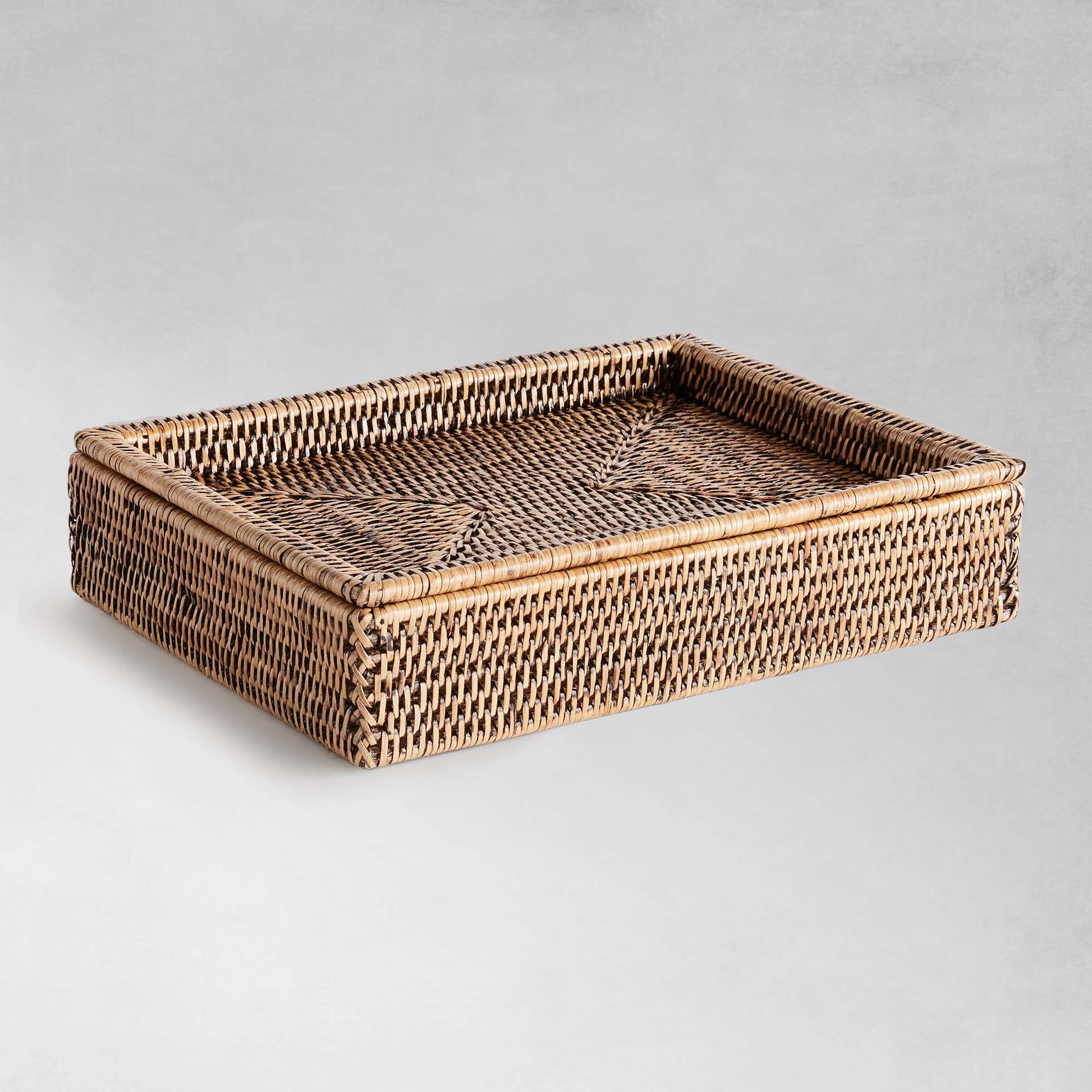 Warm brown rattan lidded letter box - stylish home accent (Image1).