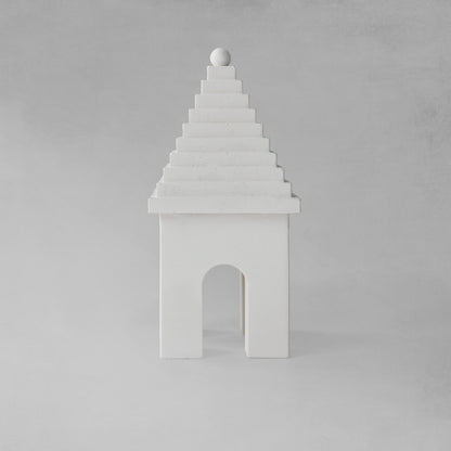 Weathered Bermudian buttery decorative object, front view, with gray background.