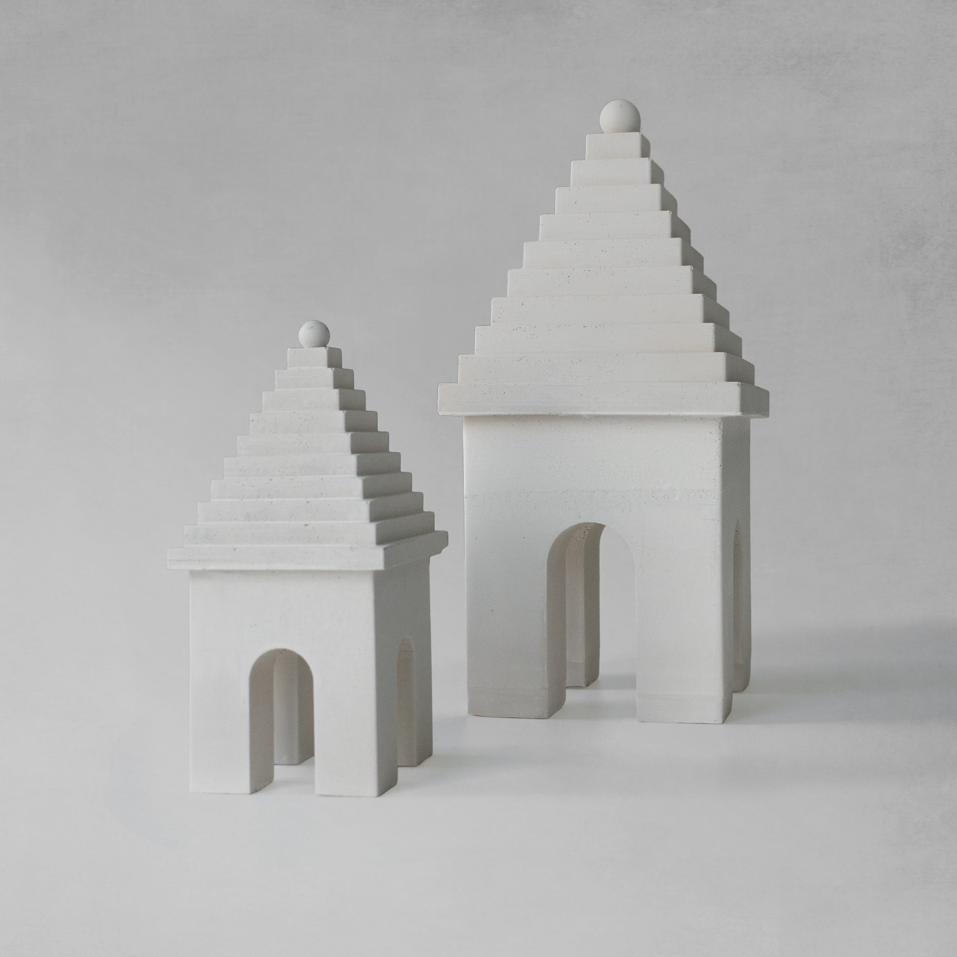 Weathered Bermudian buttery decorative objects with gray background.