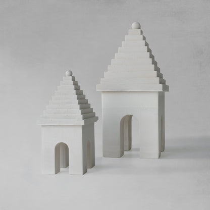 Weathered Bermudian buttery decorative objects with gray background.
