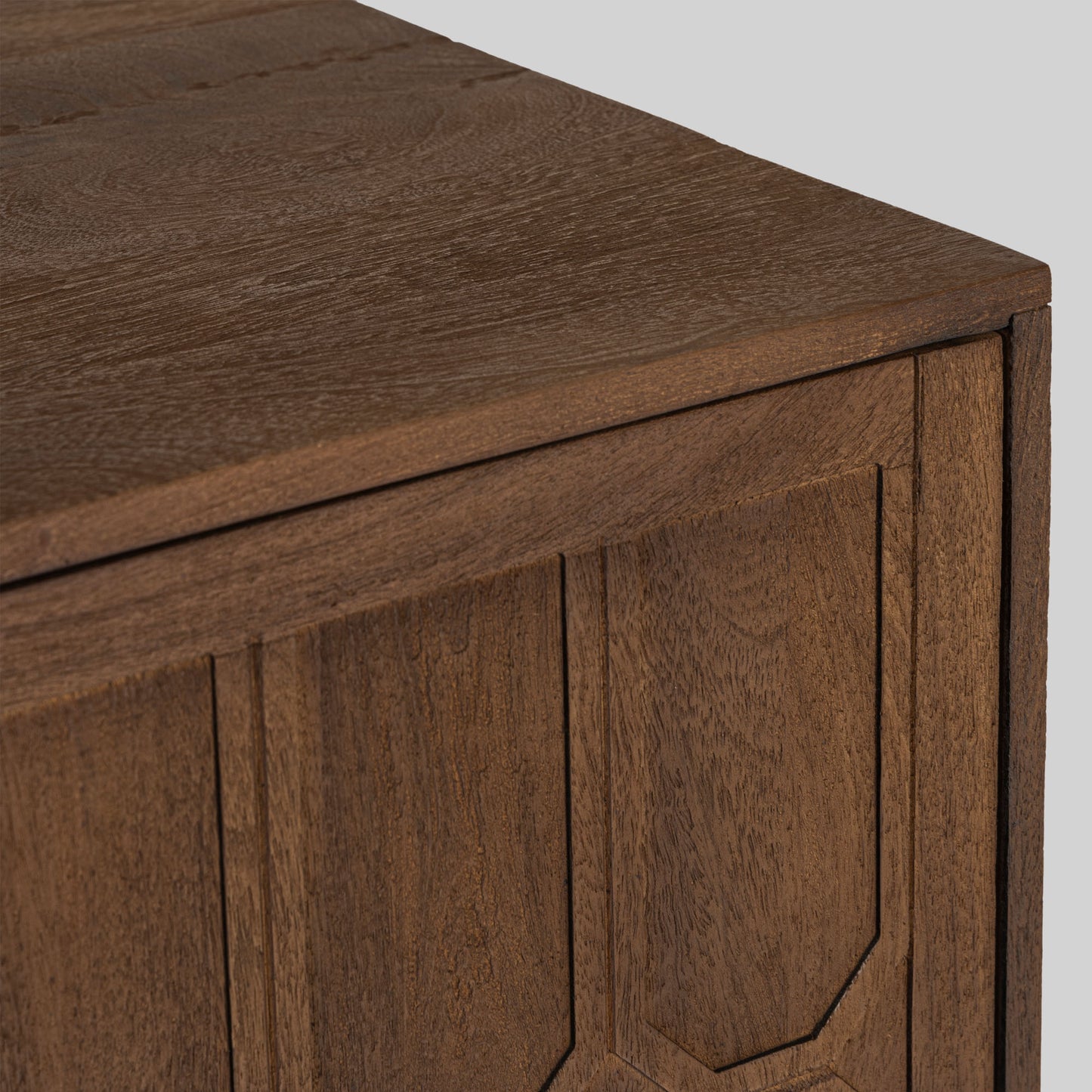 Wood sideboard with geometric pattern on a gray background.