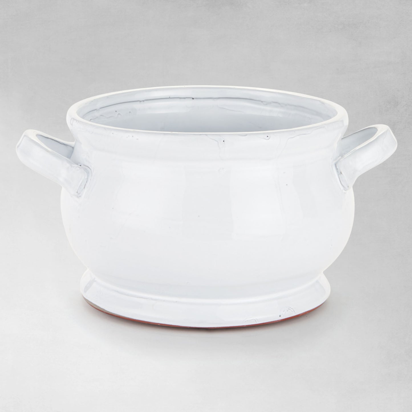 White ceramic footed bowl - stylish home accent (Image1).