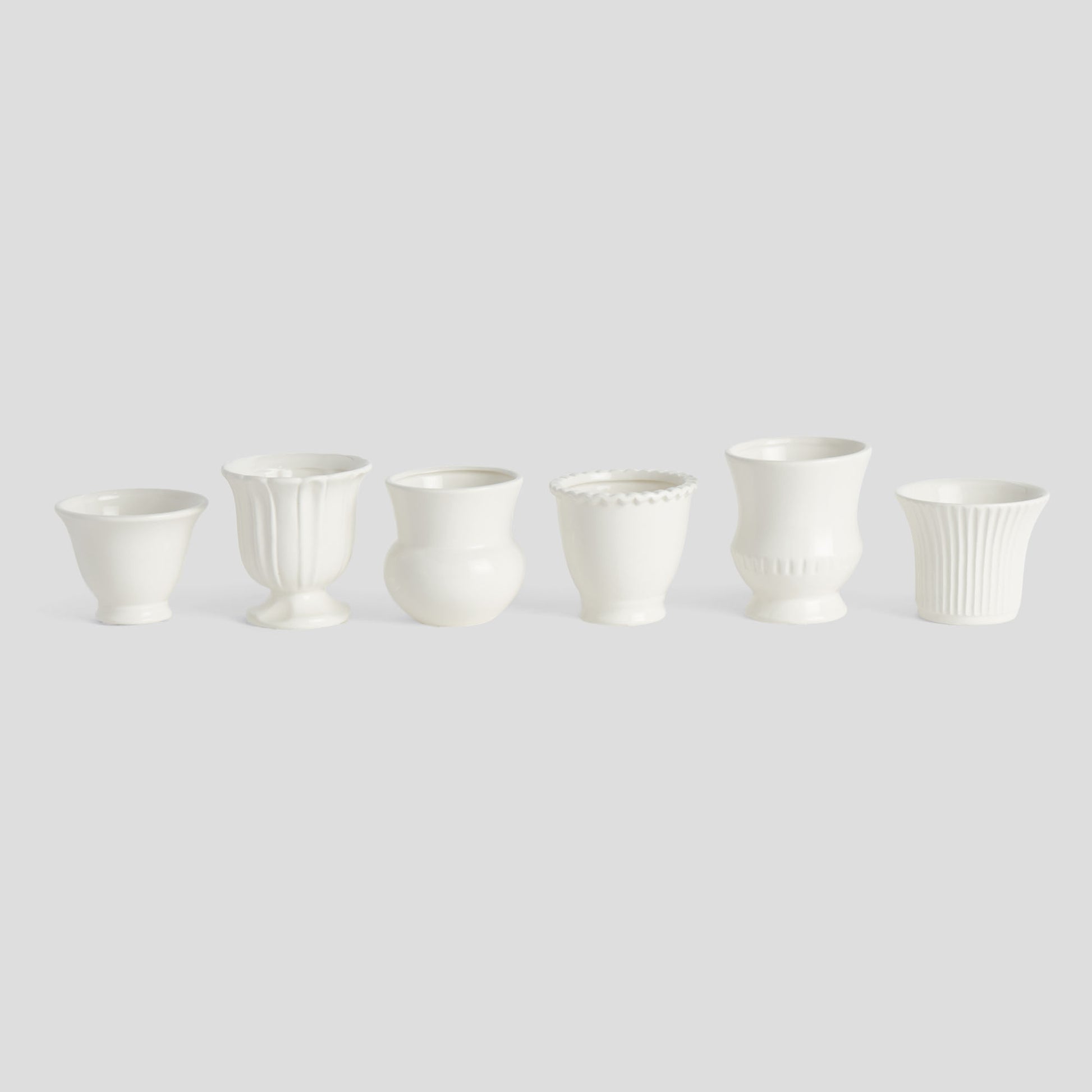 White ceramic mini cachepots (set of 6) - stylish home accent (Image1).