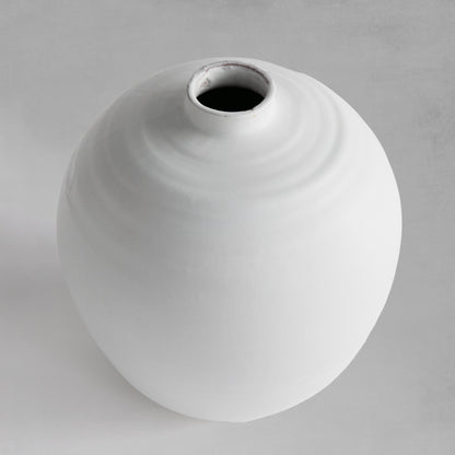 Top view of a white terracotta vase with matte glaze.