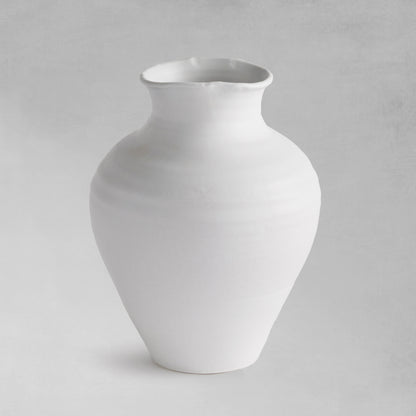 White terracotta wide-mouth vases, medium, on a gray background.