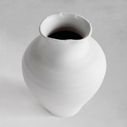 White terracotta wide-mouth vases with a medium top opening view.