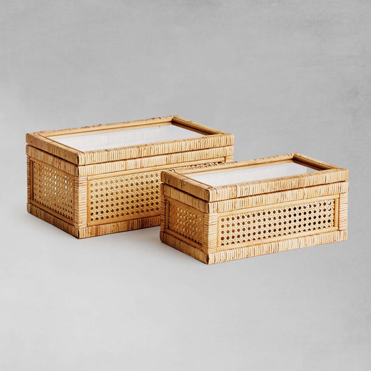 Woven rattan boxes, set of 2, with gray background.