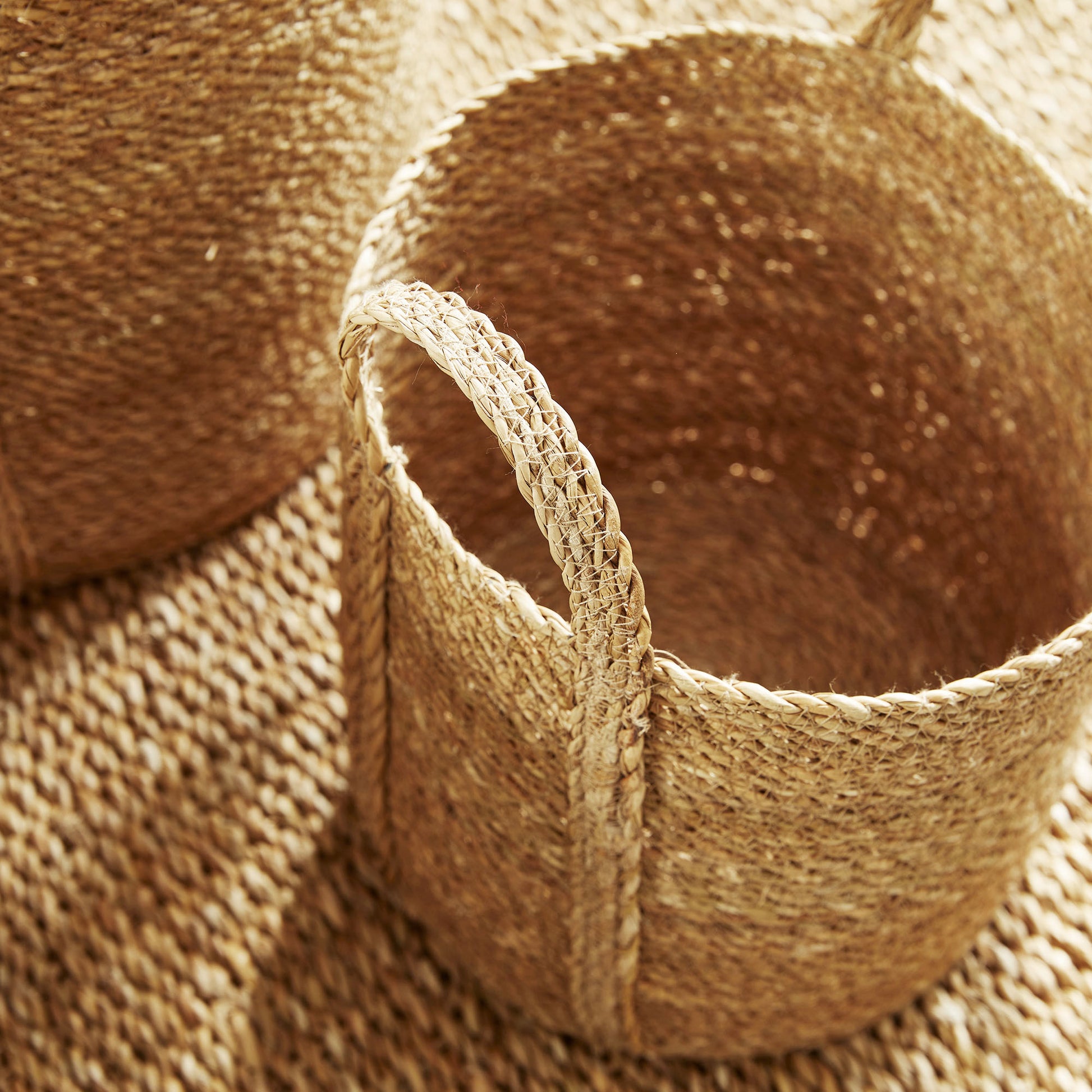 Woven seagrass round baskets, top view.