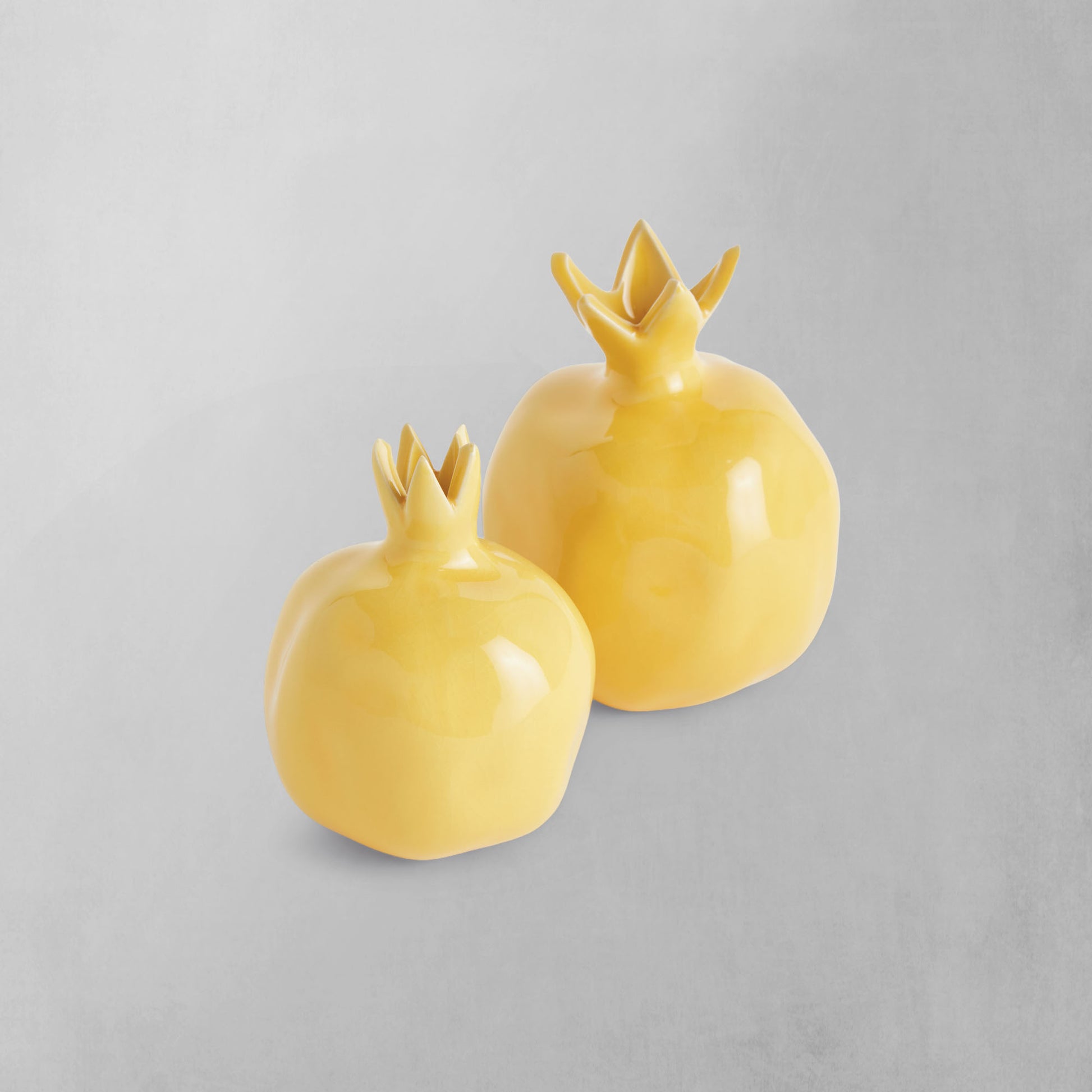 Yellow glazed ceramic bud vases (set of 2) - stylish home accent (Image1).