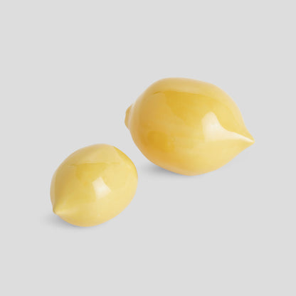 Yellow glazed ceramic lemon figurines (set of 2) - stylish home accent (Image1).
