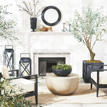 Zinc finish decorative metal bowl stylized in outdoor living space.