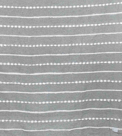 Cotton throw blanket with gray stitching and white tufted stitched stripes