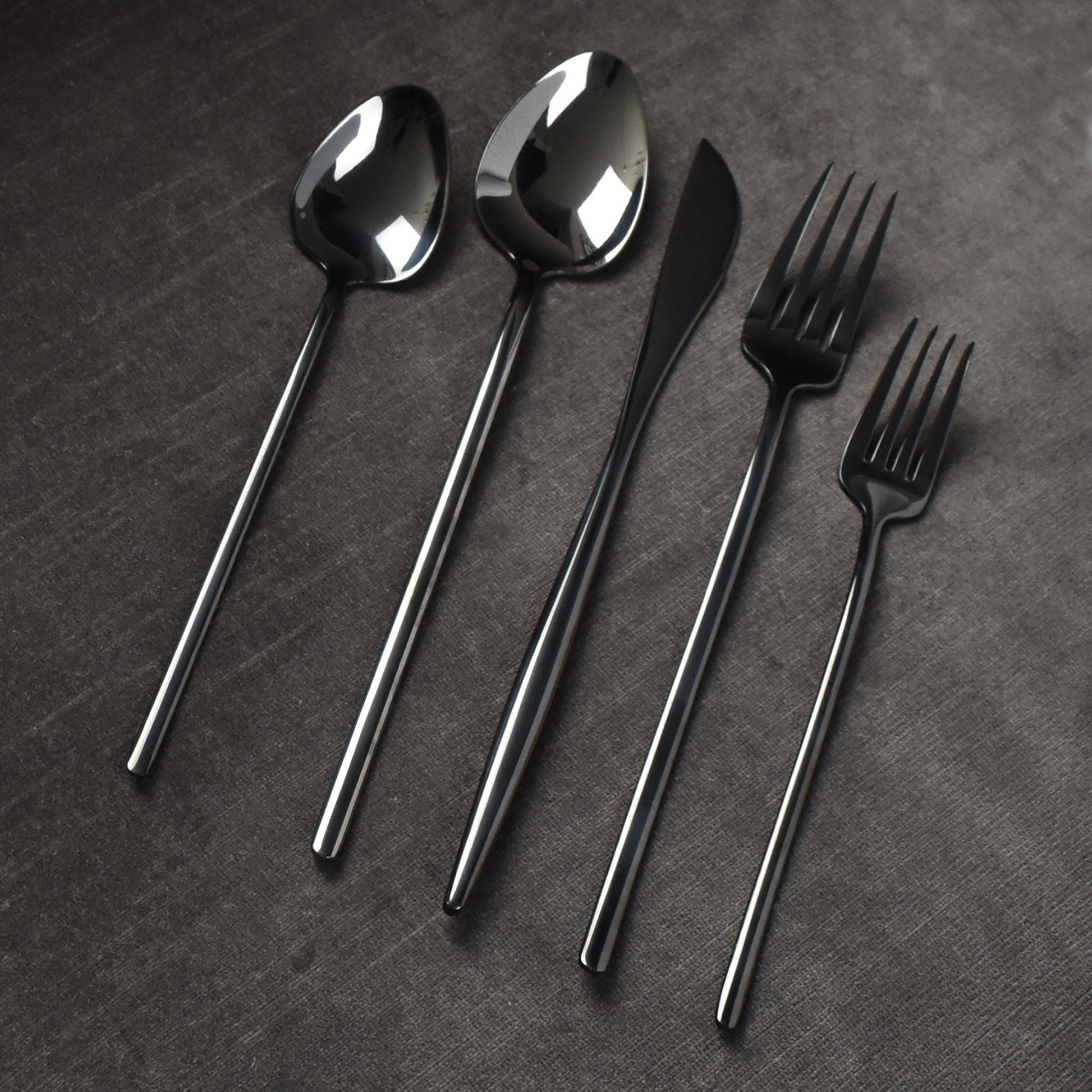 https://parkergibbs.com/cdn/shop/products/hartwell-shiny-polished-black-long-handle-modern-contemporary-flatware-cutlery-set.jpg?v=1598985903&width=1946